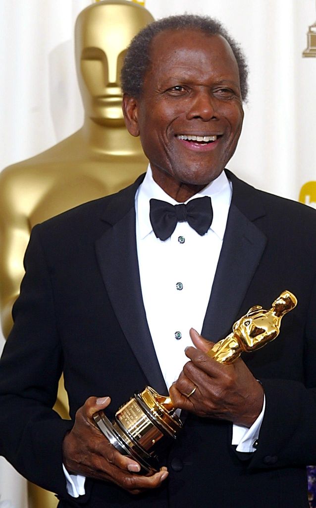 US actor Sidney Poitier hold his honorary Oscar 24 March