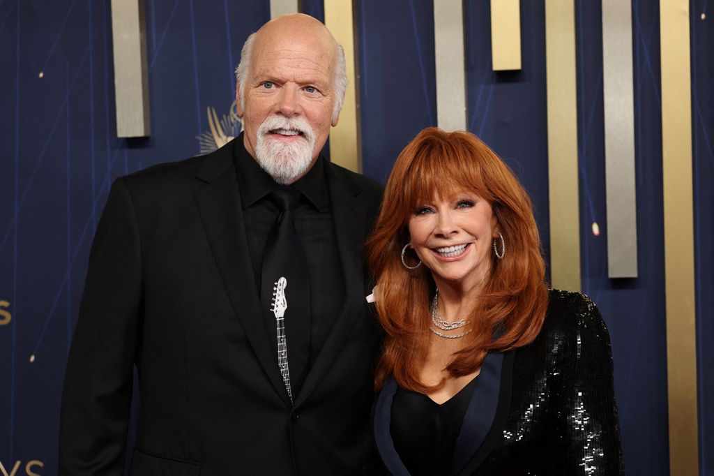 US actors Reba McEntire and Rex Linn arrive for the 77th Primetime Emmy Awards at the Peacock Theatre at LA Live in Los Angeles on September 14, 2025