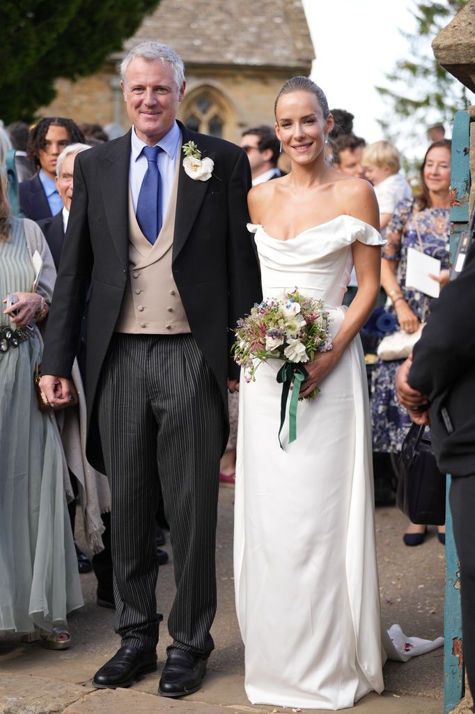 Zac Goldsmith and Hum Fleming exit the church after tying the knot