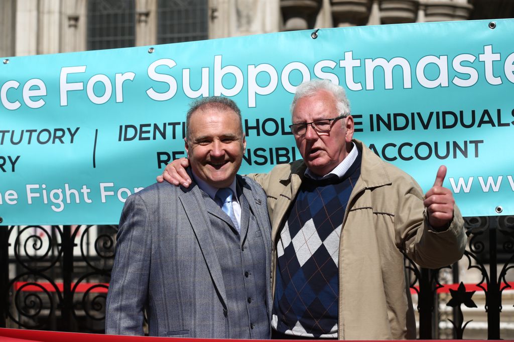 Lee Castleton with fellow former post office worker Noel Thomas celebrate outside the Royal Courts of Justice, London, after their convictions wer overturned by the Court of Appeal.
