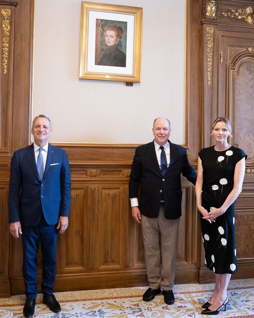 Charlene beside albert and man