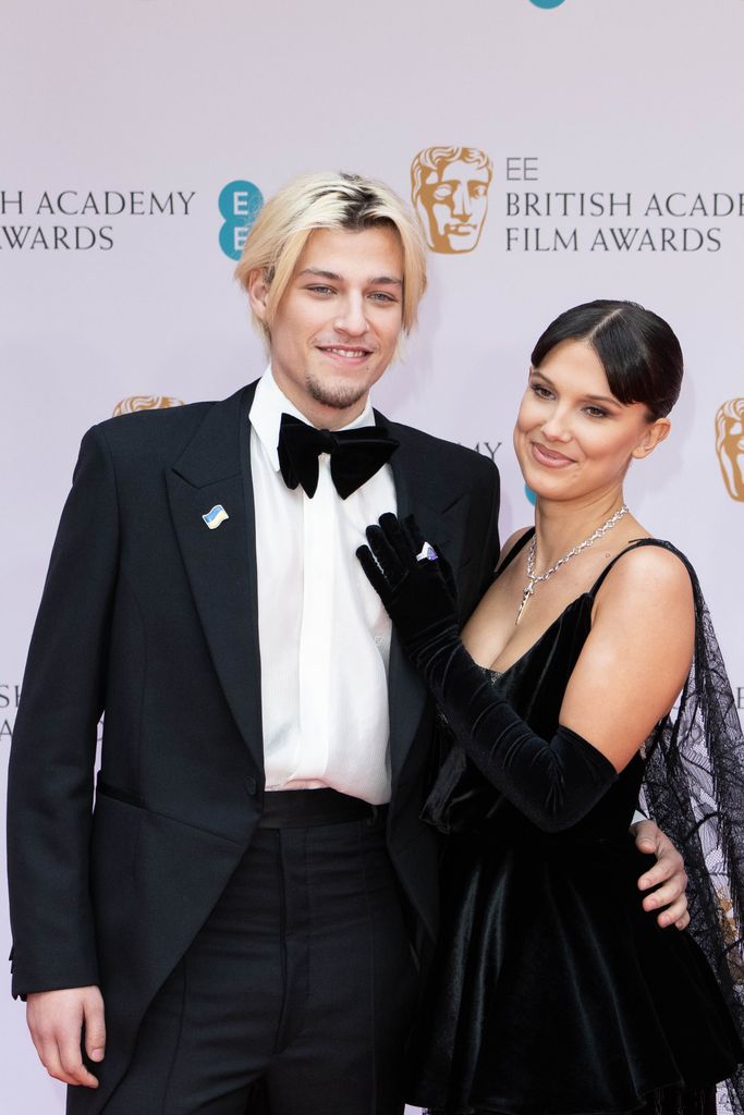 Jake Bongiovi  and Millie Bobby Brown attend the EE British Academy Film Awards 2022 at Royal Albert Hall on March 13, 2022 in London, England