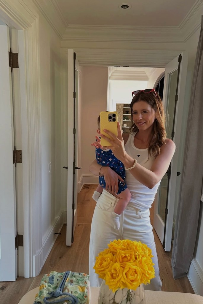 Photo shared by Katherine Schwarzenegger on Instagram from Fourth of July weekend featuring her baby son Ford on her hip