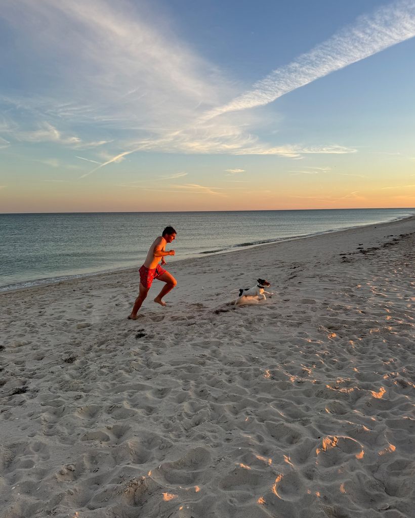 max running on beach with dog 