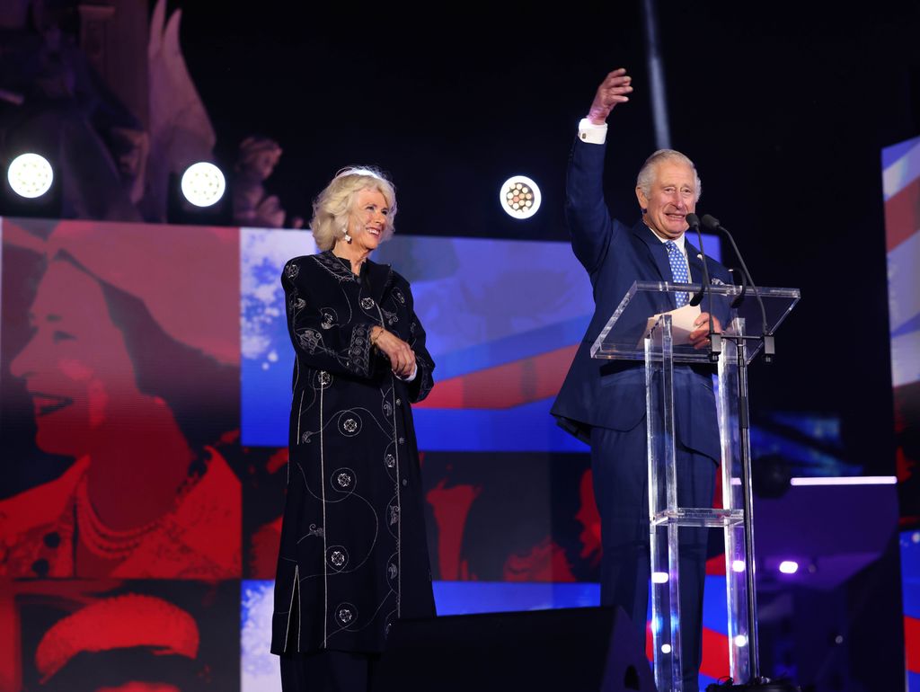 charles and camilla speaking on stage