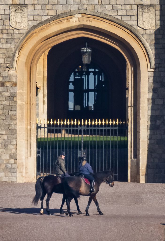 Andrew Mountbatten Windsor is seen out riding with a groom at Windsor Castle today for the first time since losing his royal titles. 