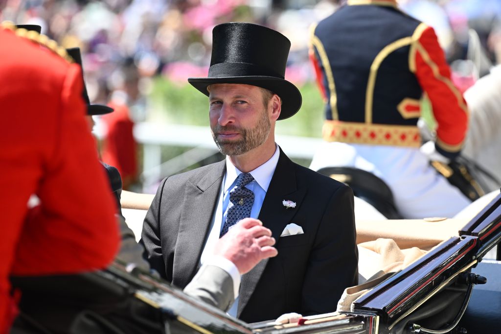 Prince William wearing top hat in carriage