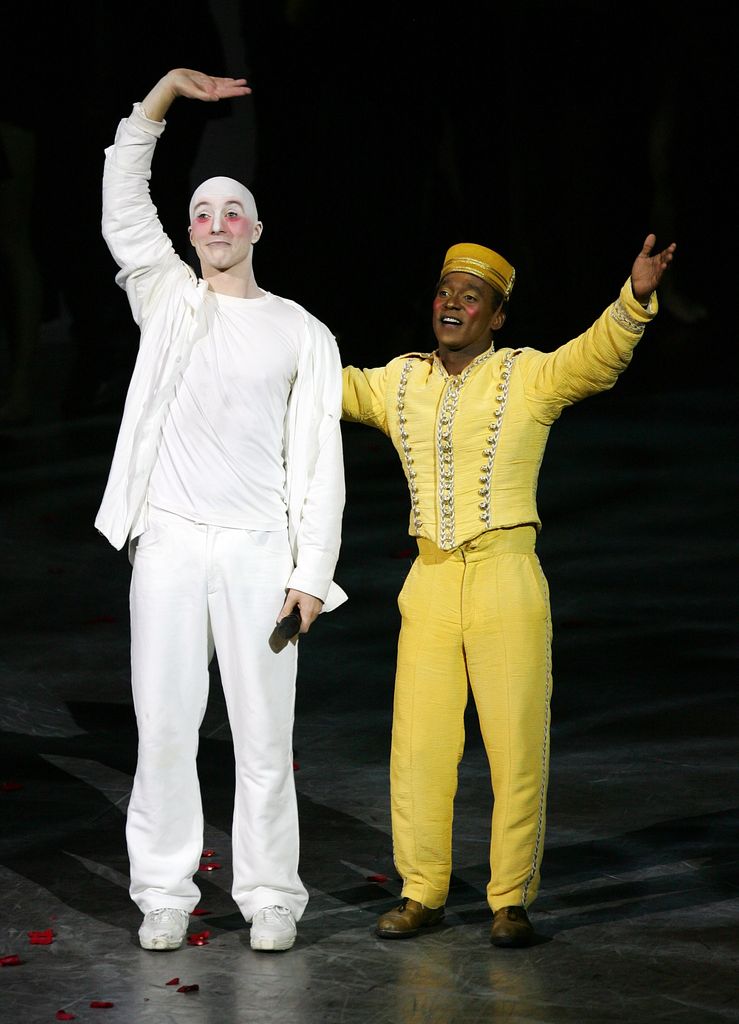 Dancers Elijah Brown and Jean-Christophe Dasse wave after the final performance of Celine Dion's show "A New Day..." at The Colosseum at Caesars Palace December 15, 2007 in Las Vegas, Nevada. Nearly three million people watched Dion perform 717 shows since it opened in March 2003.
