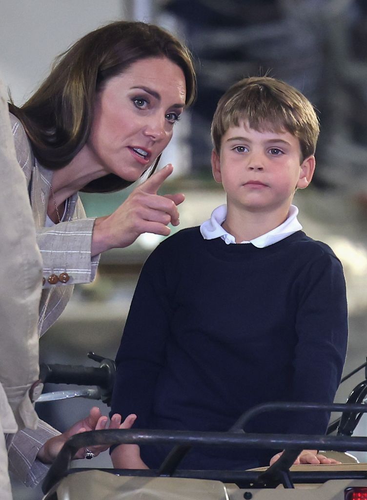 Prince Louis of Wales sits inside a vehicle on a C17 plane with his mother Princess Kate