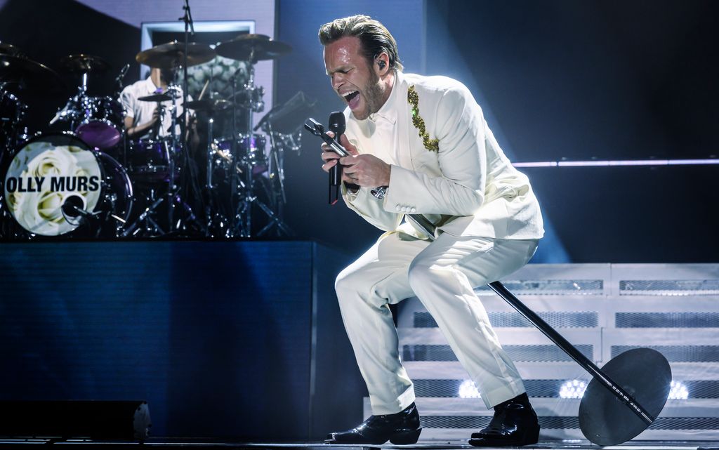 Olly Murs performing in white
