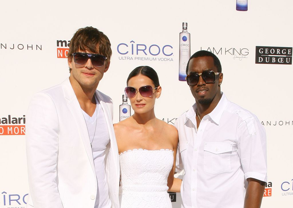 Ashton Kutcher, Demi Moore and Sean "Diddy" Combs arrive to the White Party to benefit Malaria No More held at a private residence on July 4, 2009 in Beverly Hills, California