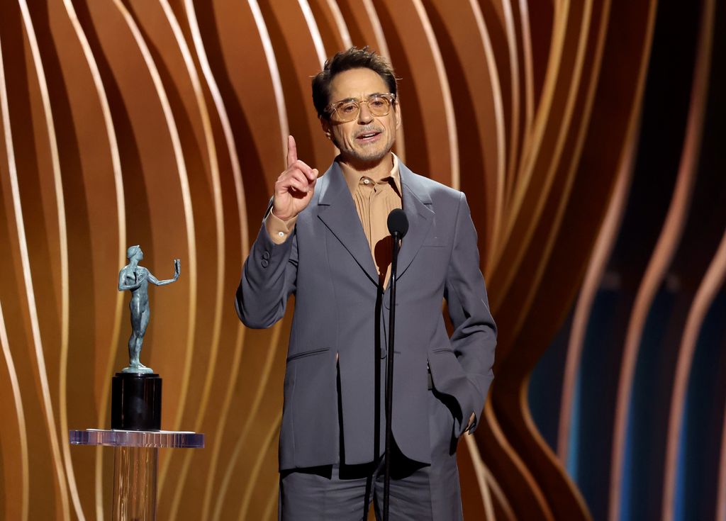Robert Downey Jr. accepts the Outstanding Performance by a Male Actor in a Supporting Role in a Motion Picture award 