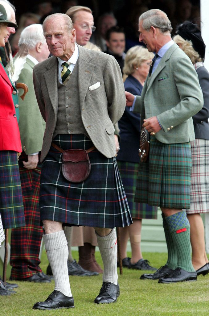 Prince Philip and Prince Charles wearing kilts at the 2006 Braemar Gathering