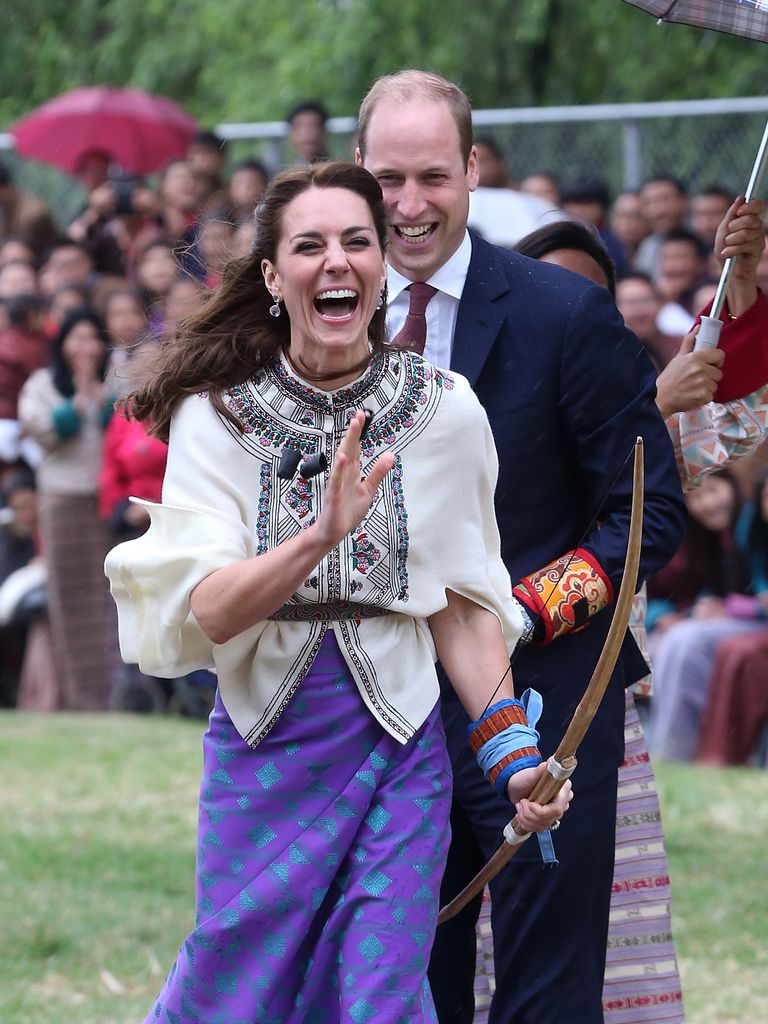 Kate laughs as she tries archery in Bhutan