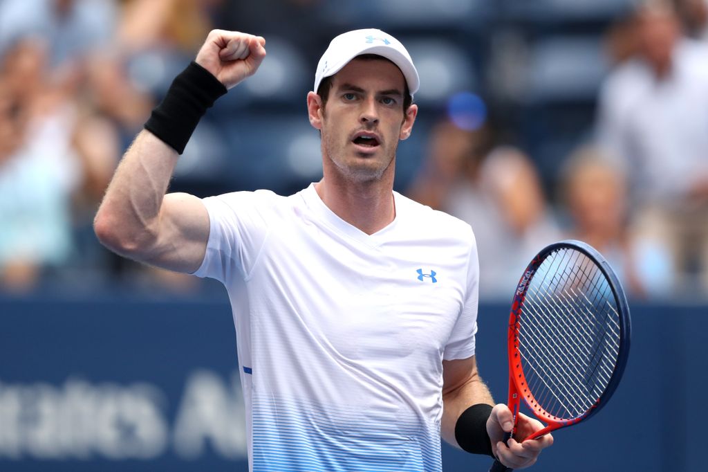 Andy Murray punching the air whilst holding his tennis racket 