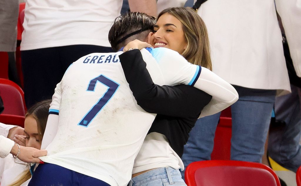 couple embracing at football match