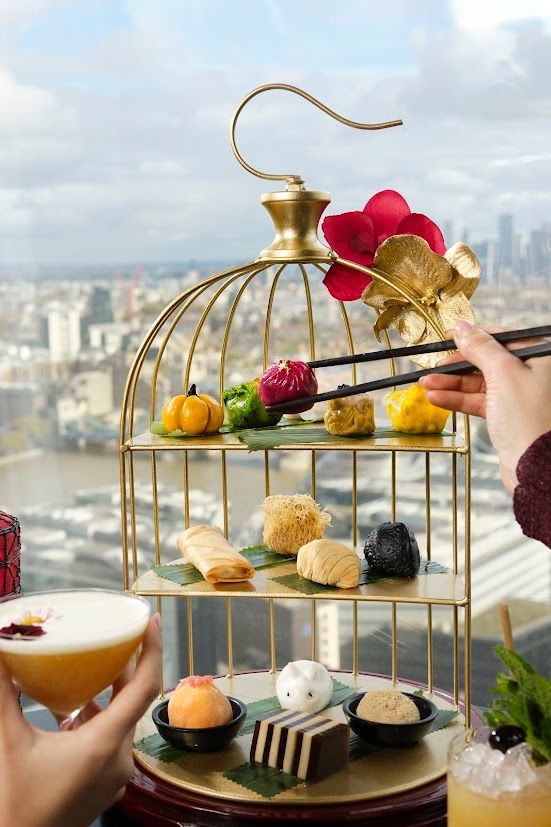 dim sum on cake stand overlooking london