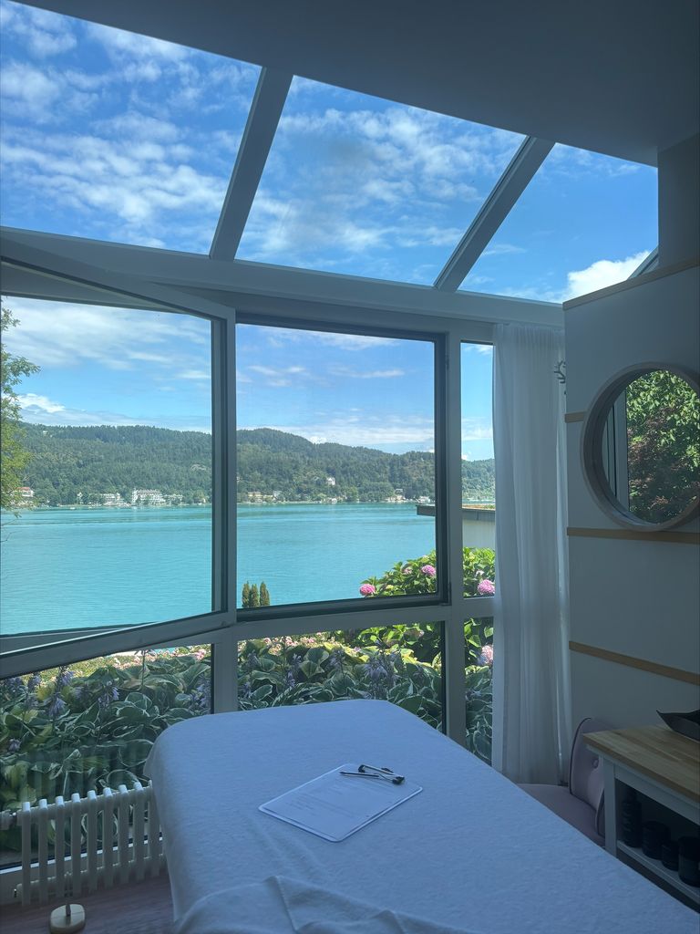 spa bed with a clear blue lake in the background