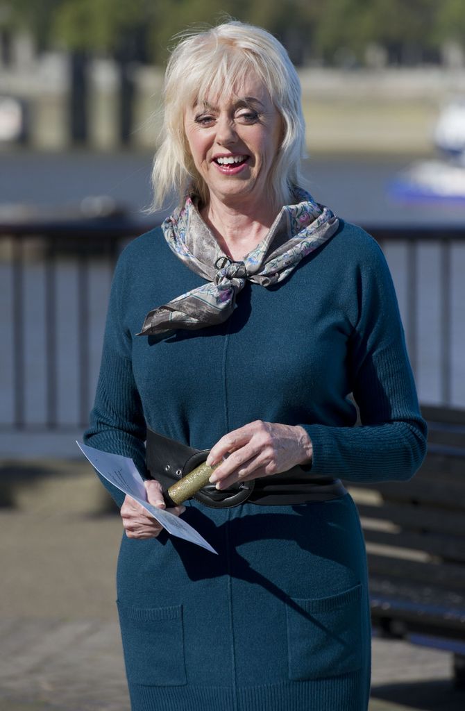 Weather presenter standing in sun