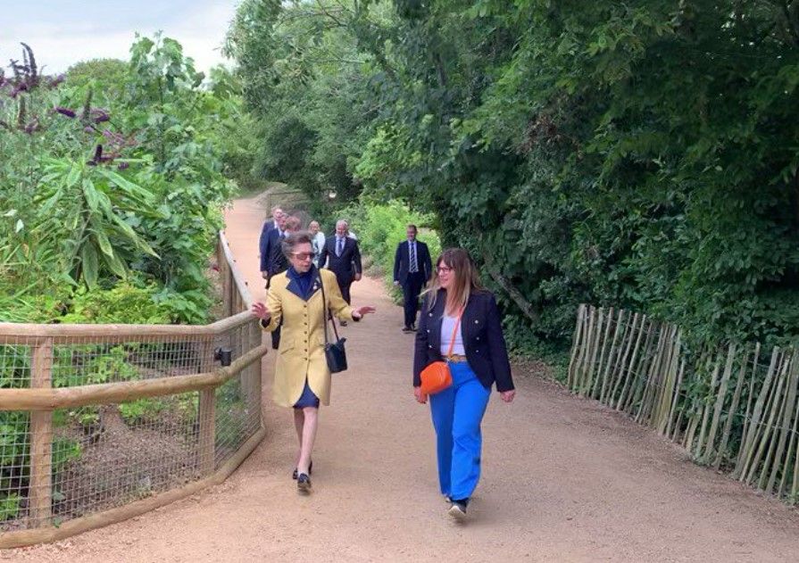 Princess Anne the Princess Royal visiting Jersey Soo in yellow and navy outfit