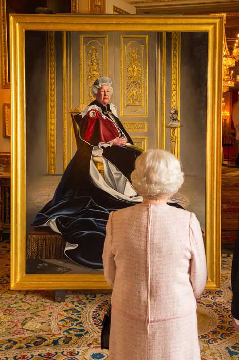 queen looking at portrait