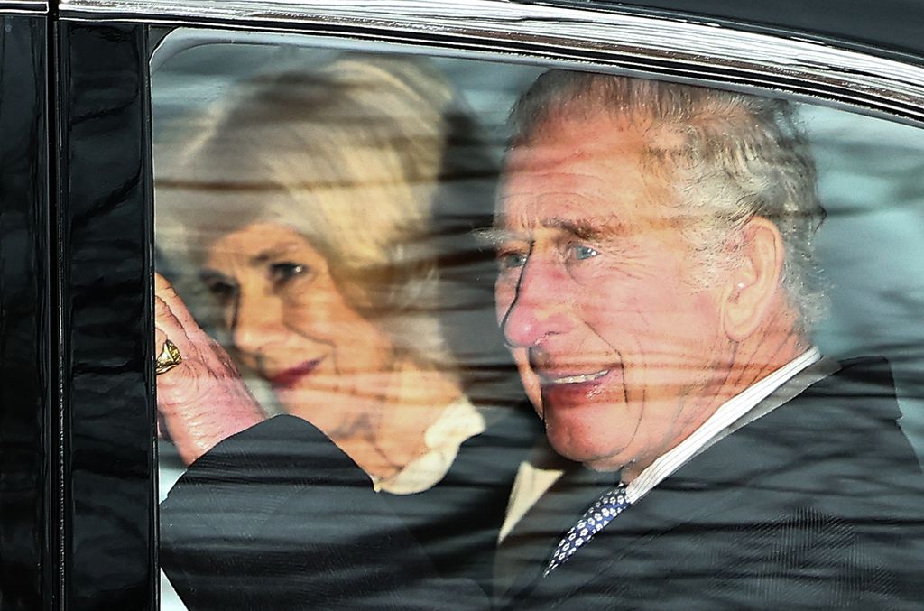 King Charles and Queen Camilla wave