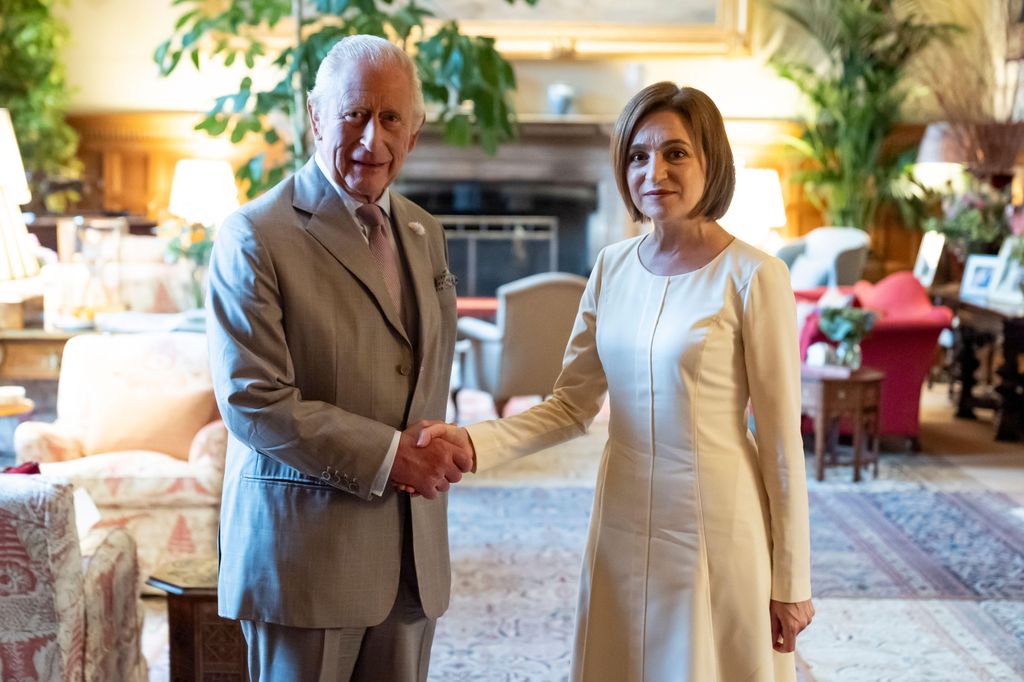 King Charles shaking hands with Maia Sandu
