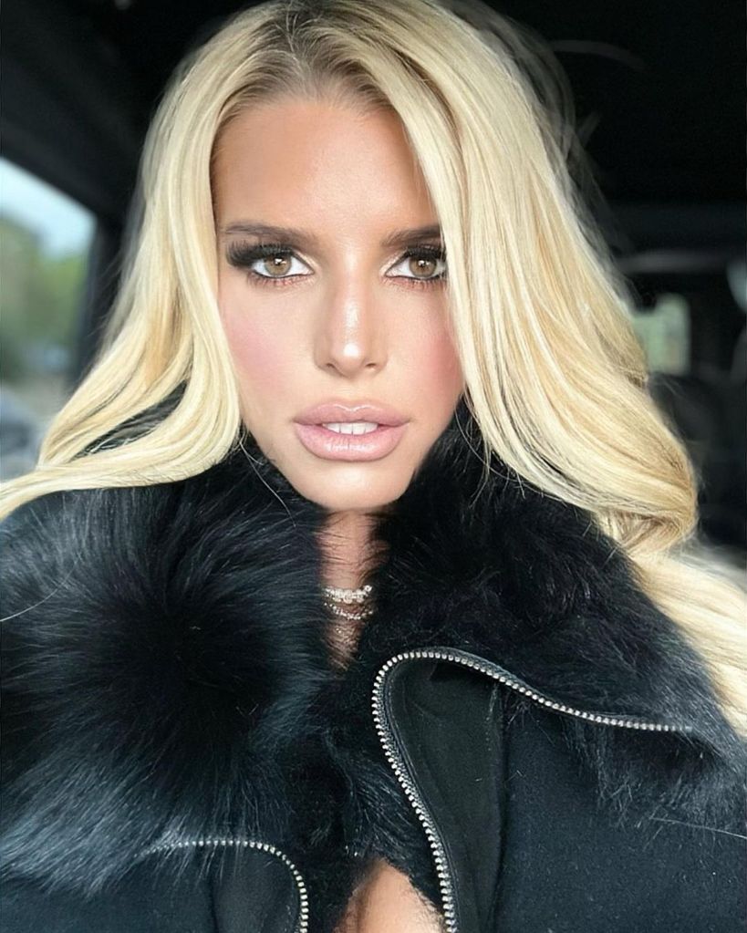 Jessica Simpson wearing a fur coat with glam makeup
