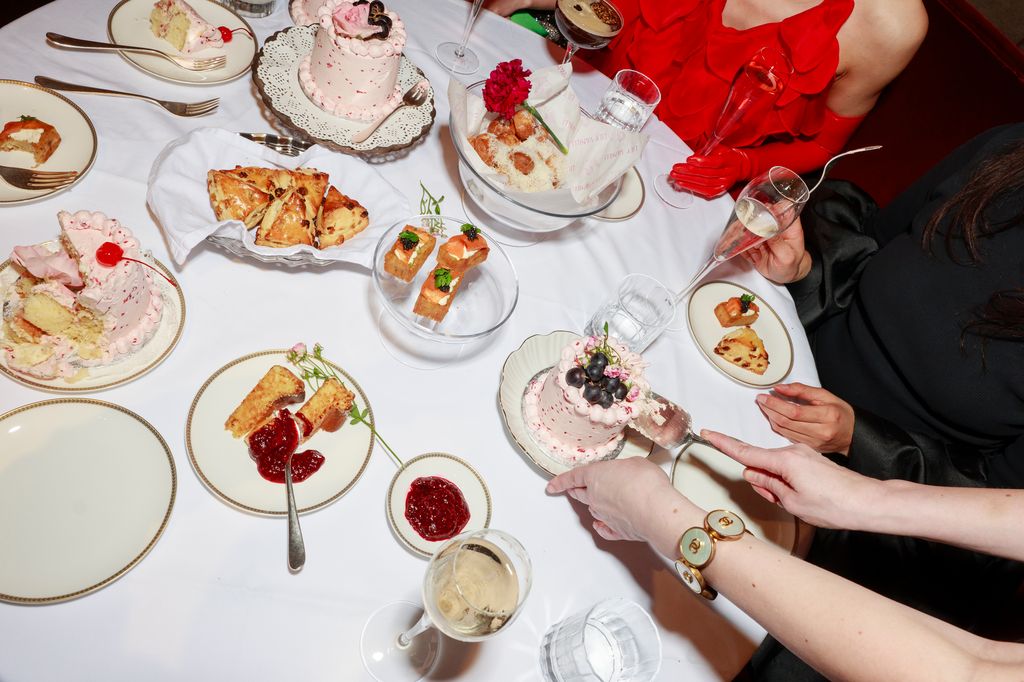 Photo of guests enjoying afternoon tea around a table