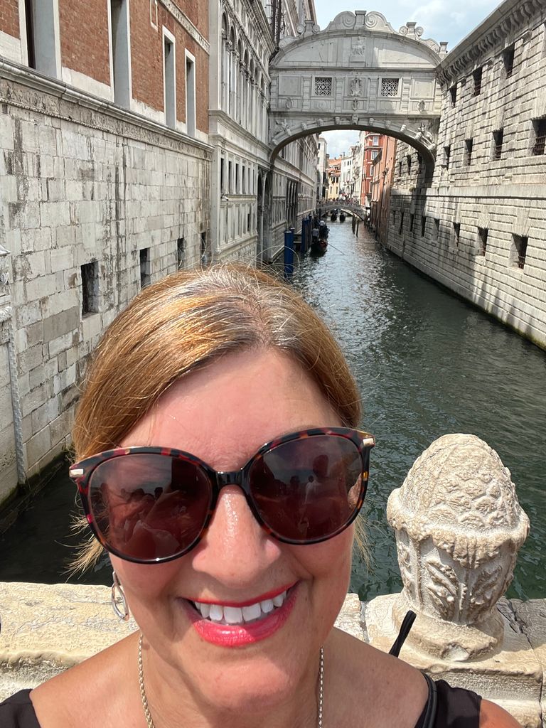 Woman taking a selfie on a bride in Venice 