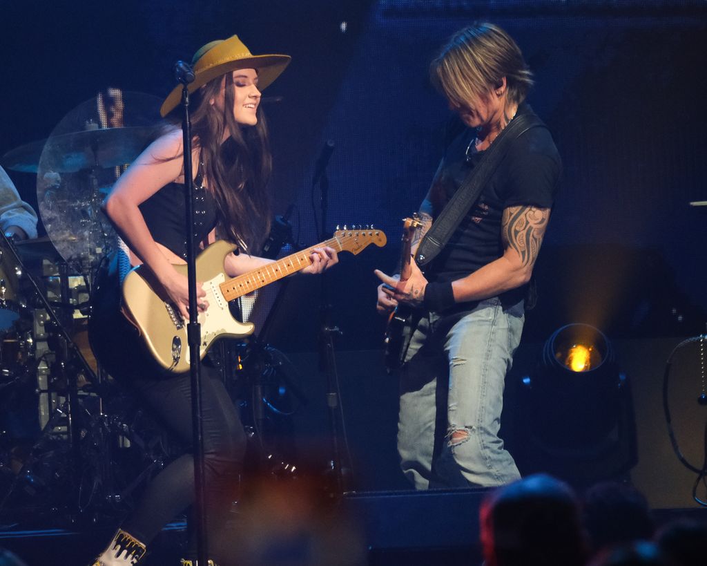 Maggie Baugh and Keith Urban perform onstage at the 2024 iHeartCountry Festival - Show at Moody Center on May 04, 2024 in Austin, Texas
