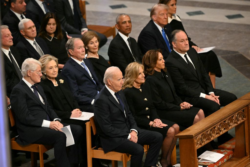 From L to R, front row, US President Joe Biden, First Lady Lady Jill Biden, Vice President Kamla Harris, Second Gentleman Doug Emhoff, second row, former President Bill Clinton, former Secretary of State Hillary Clinton, former President George W. Bush, his wife Laura Bush, former President Barack Obama, President-elect Donald Trump and his wife Melania Trump attend the State Funeral Service for former US President Jimmy Carter at the Washington National Cathedral in Washington, DC, on January 9, 2025