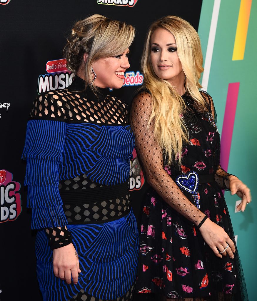 Kelly Clarkson and Carrie Underwood at the 2018 Radio Disney Music Awards