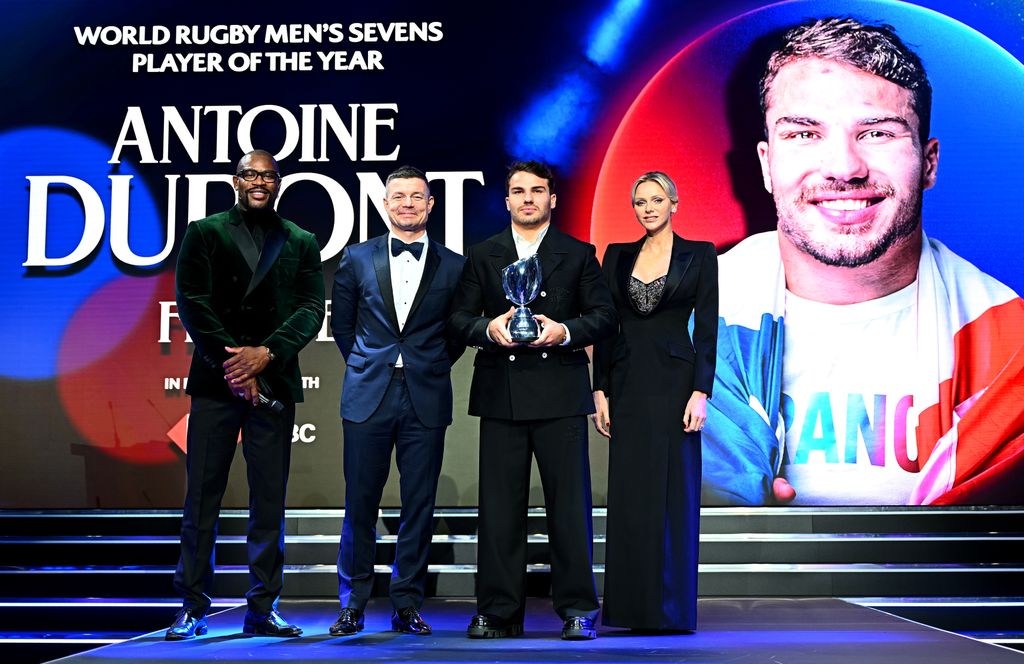 Ugo Monye, Brian O'Driscoll pose for a photo with Antoine Dupont of France and Charlene, Princess of Monaco