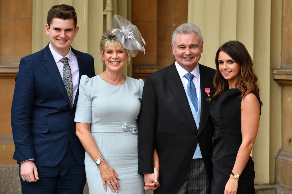 Journalist and broadcaster, Eamonn Holmes, (2R), with his wife Ruth Langsford (2L), his son Jack (L) and daughter Rebecca, poses with his medal after he was appointed Officer of the Order of the British Empire (OBE) for services to broadcasting, by Britain's Queen Elizabeth II during an investiture ceremony at Buckingham Palace in London on June 1, 2018