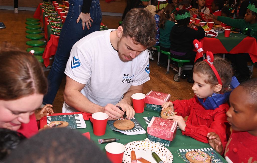 Will Poulter decorating cookies with children


