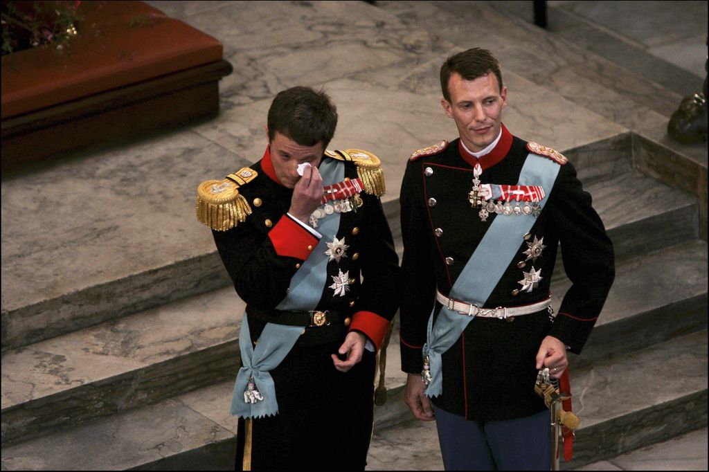 Crown Prince Frederik of Denmark wiping tears from his eyes at the altar