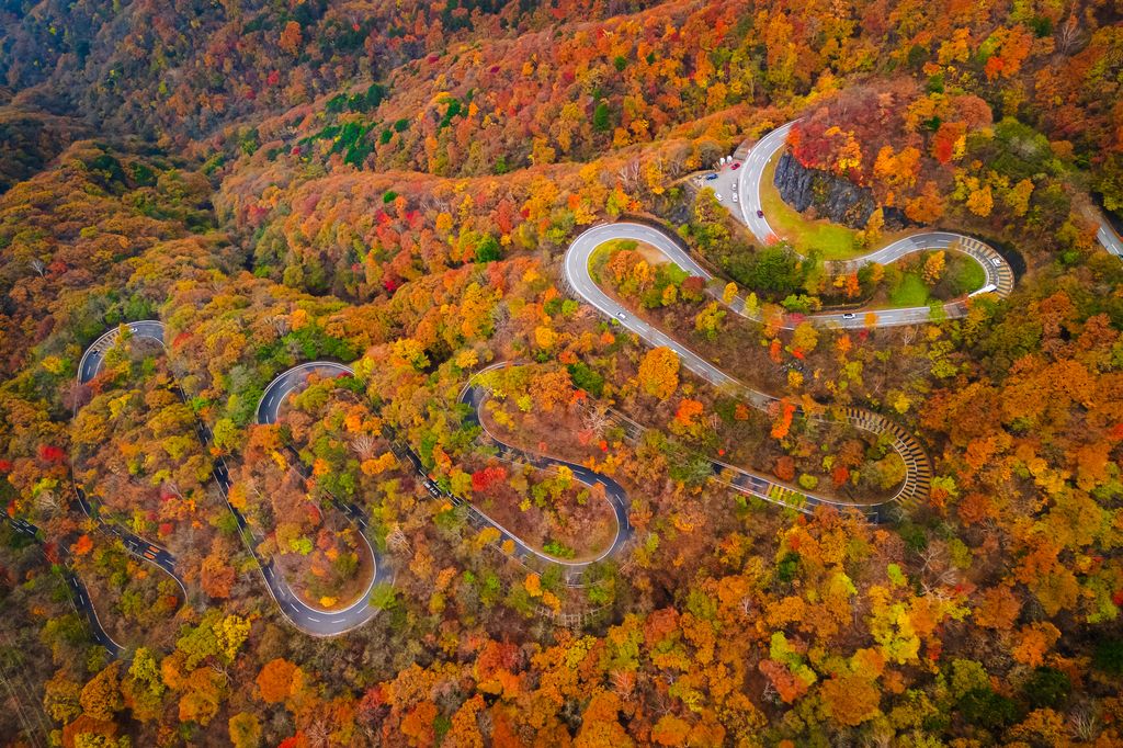 Aerial view of a winding road with beautiful mountains in Nikko, Japan