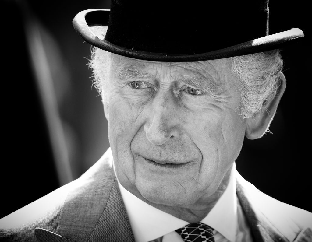 King Charles in black and white wearing a top hat