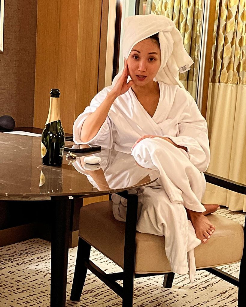 Brenda Song in a bathrobe and hair towel