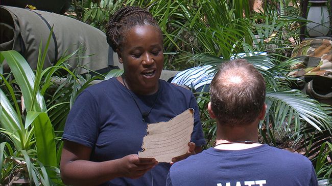 Charlene reads camp leader letter