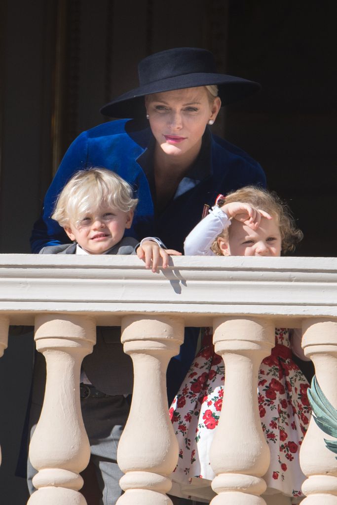 Princess Charlene of Monaco with Prince Jacques of Monaco and Princess Gabriella of Monaco greet the crowd from the Palace's balcony during the Monaco National Day Celebrations on November 19, 2017 