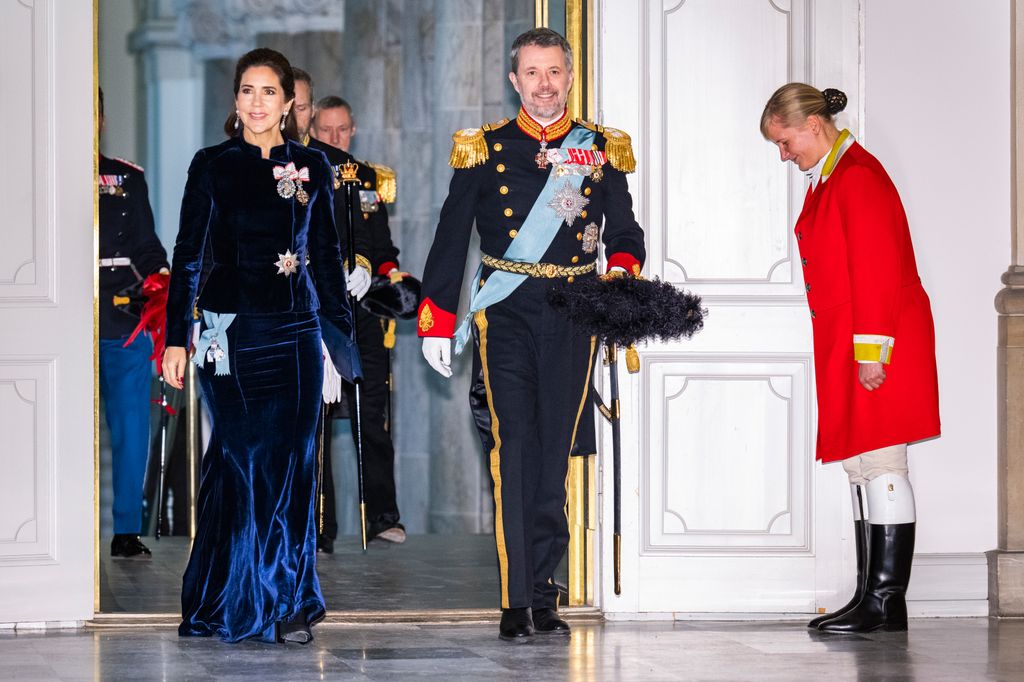 King Frederik X of Denmark and Queen Mary of Denmark entering Christiansborg Palace in gown and uniform