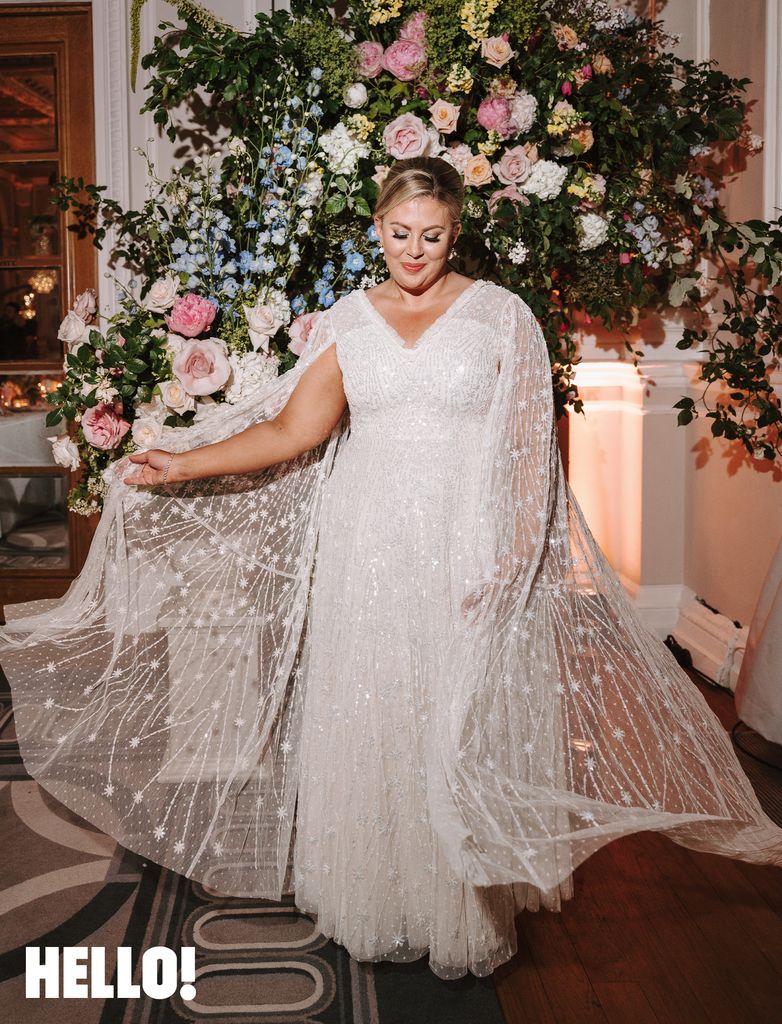 Louise Pentland waving the cape of her second bridal gown