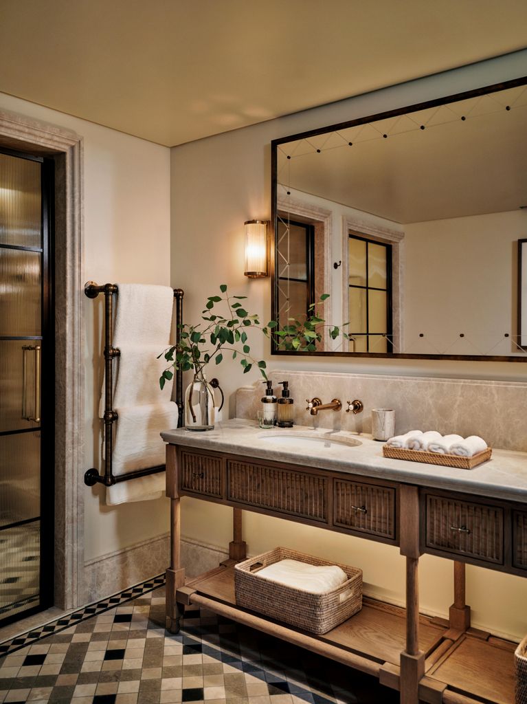 hotel neutral bathroom with mirror and sink