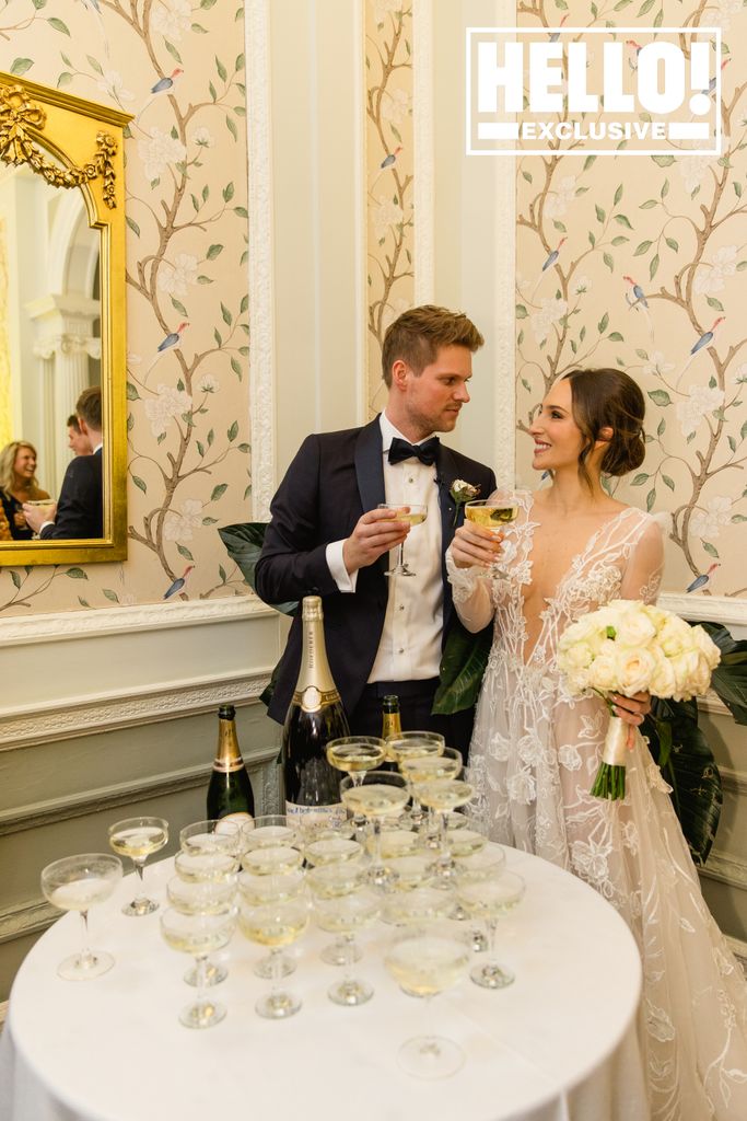 Maeva Dascanio and James Taylor having champagne toast after Hedsor House wedding