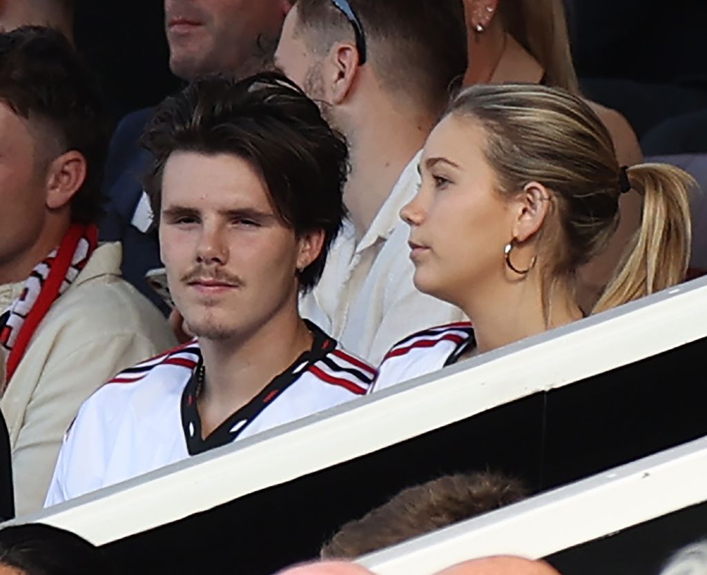 Cruz watched from the director's box during the Premier League match between Manchester United and Fulham FC with girlfriend Tana