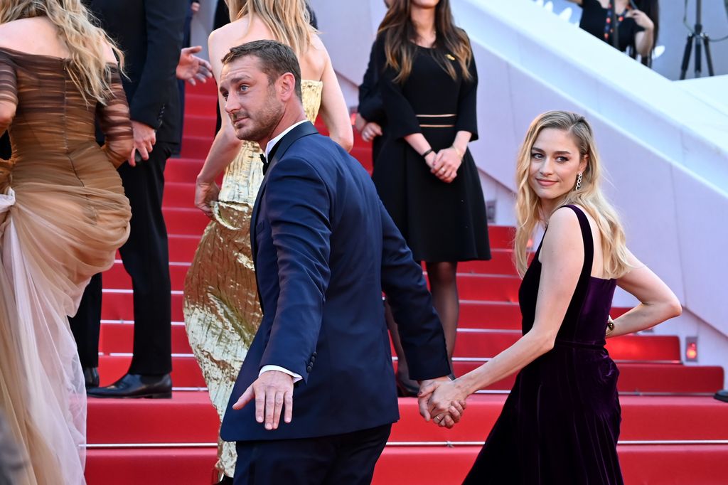 couple walking up steps at cannes film festival