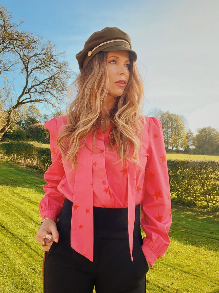 Lady in pink top with hat