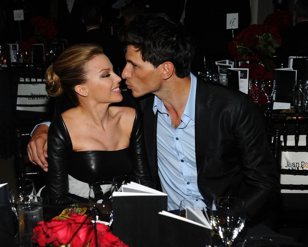 Andres Velencoso going in to kiss Kylie Minogue